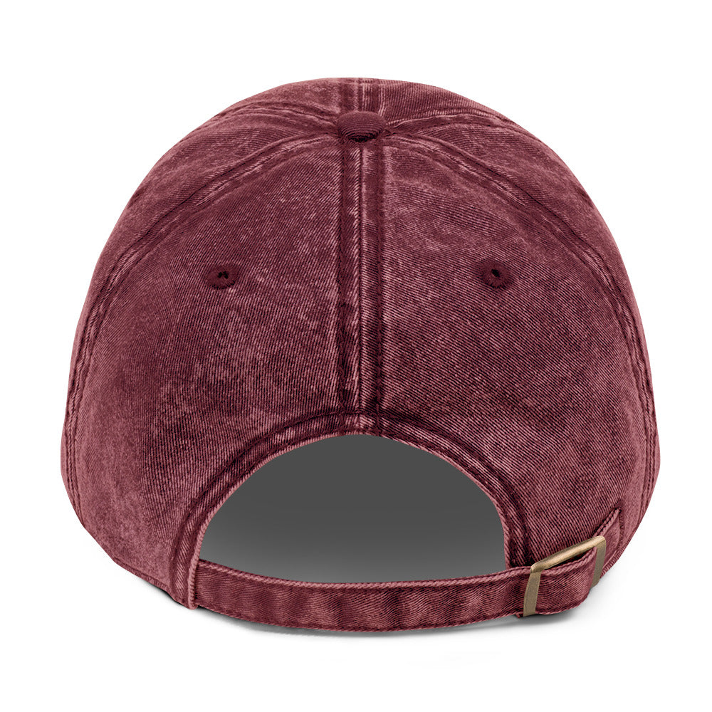 Maroon baseball cap with a strap on a white background