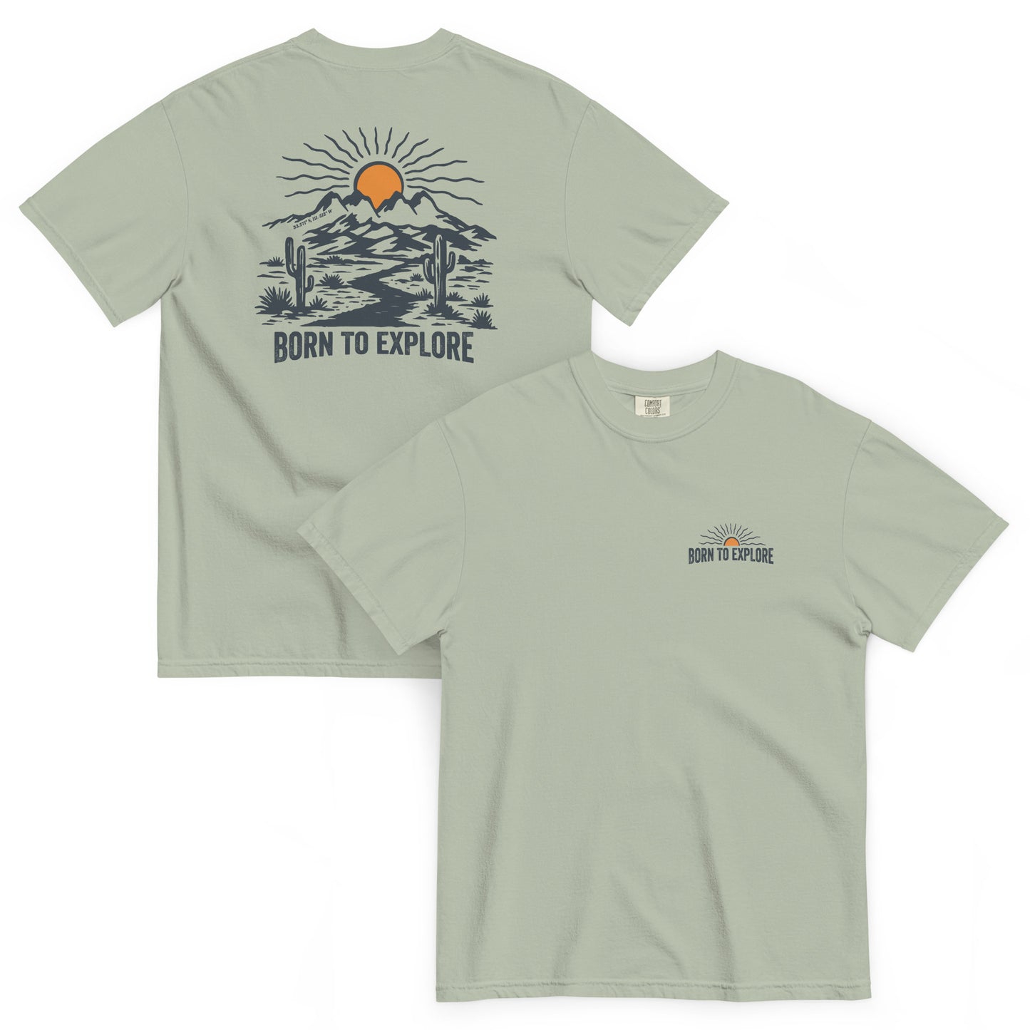 Light green t shirt with nature themed graphic design, sun, mountain, cacti and dirt trail with the text 'born to explore'