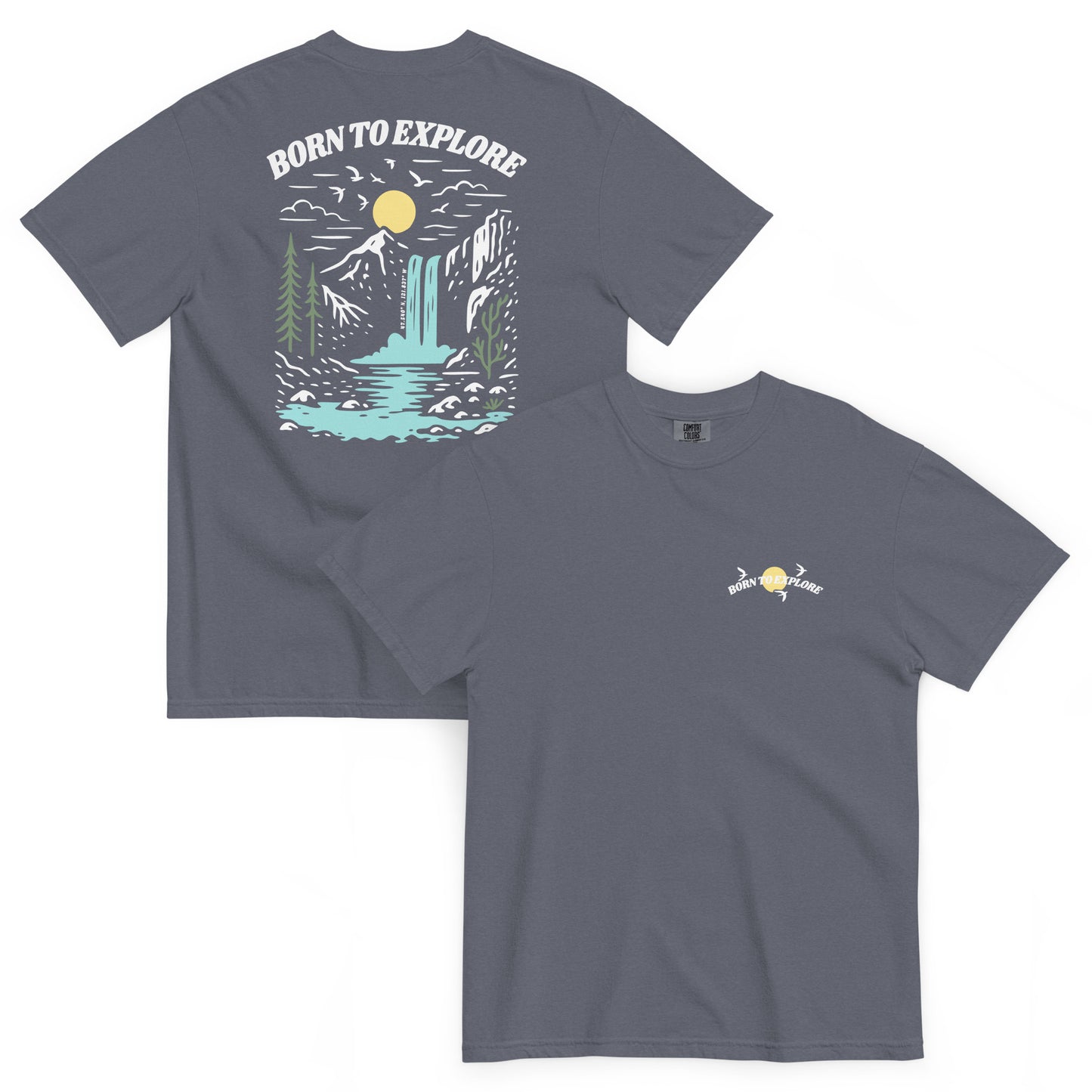 Denim colored t-shirt with nature-themed design, trees, mountain, waterfall, birds flying near sun and 'Born to Explore' text on a white background