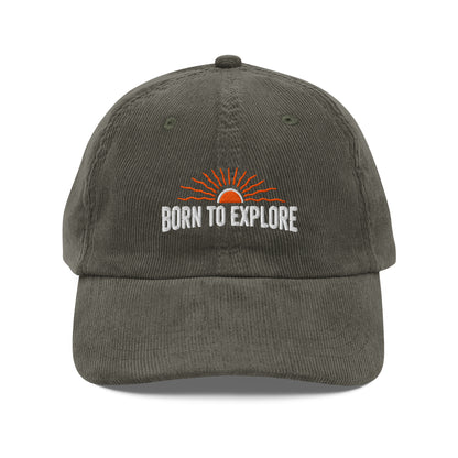 Gray/light green cap with 'Born to Explore' text and sun graphic on a white background