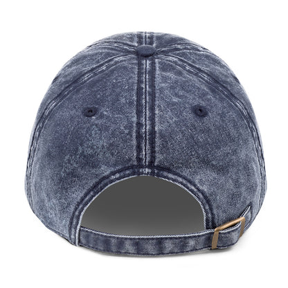 Blue denim cap with a strap on a white background